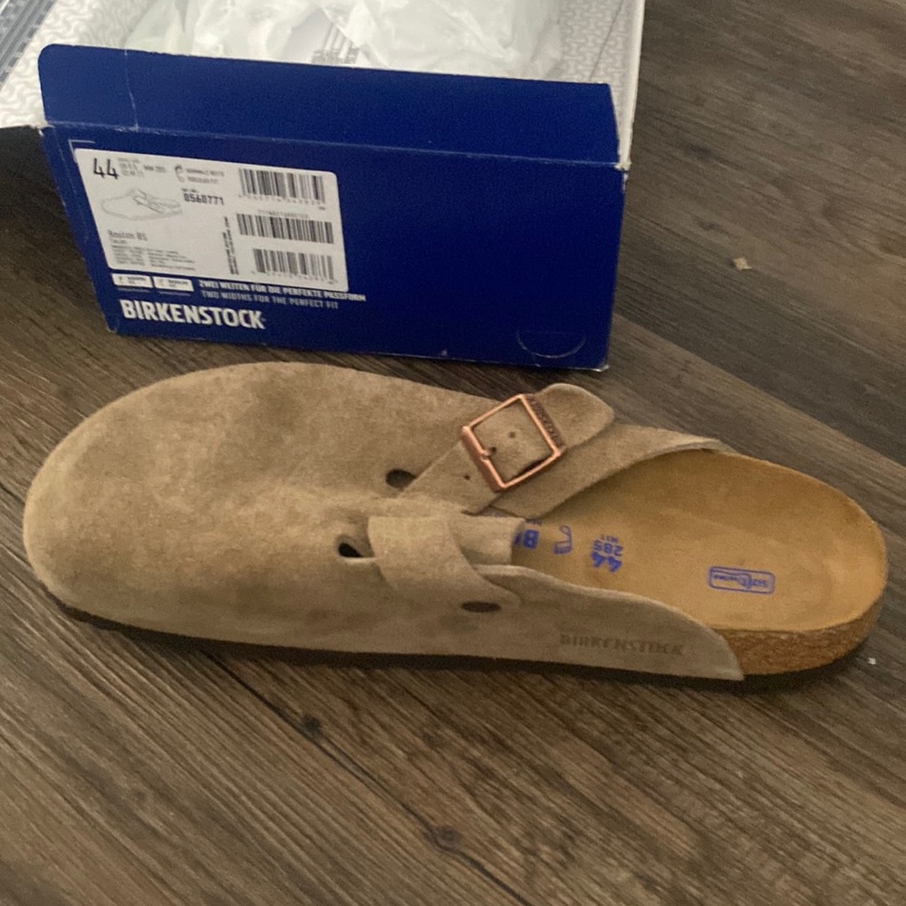 Never worn Birkenstocks, still in box.